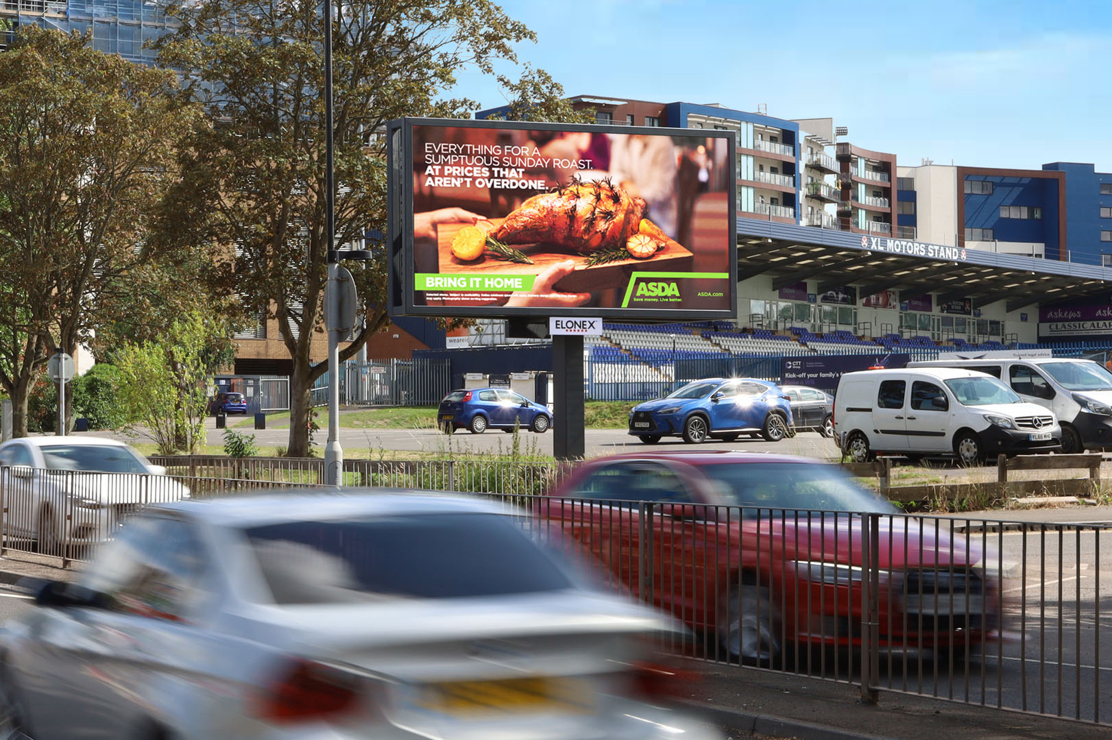 Digital roadside billboard on Butts Road in Coventry displaying DOOH advertising to passing traffic.
